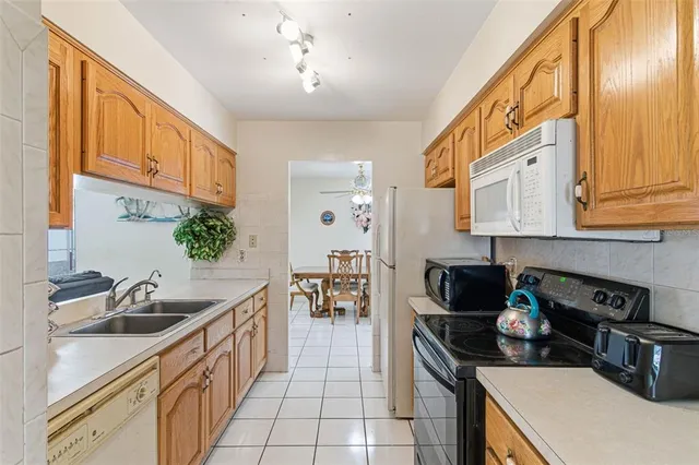 a kitchen that has a sink and a stove