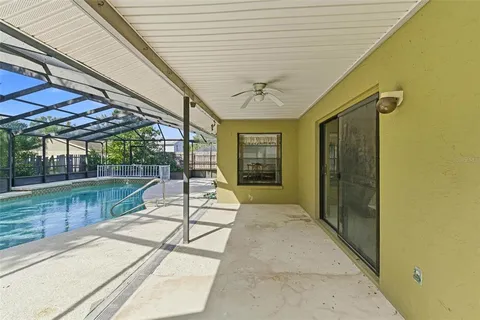 a view of a swimming pool with a patio