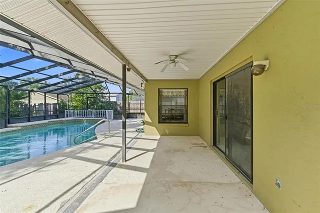 a view of a swimming pool with a patio