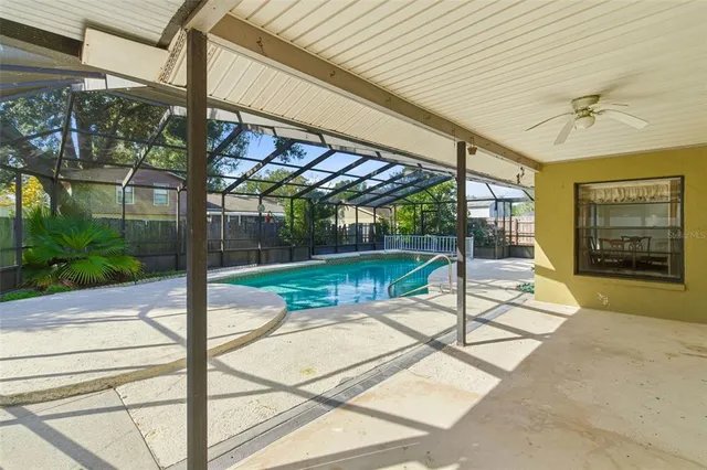 a view of a patio with a table and chairs