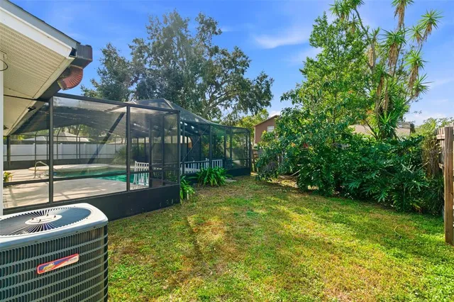 a view of a backyard with swimming pool