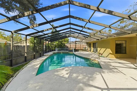 a view of a swimming pool with a patio