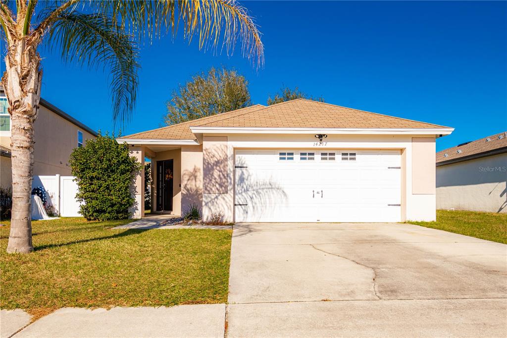 14217 Lemon Yellow Tree Lane Brooksville, FL 34613 - Photo 1 of 1 a view of a house with a swimming pool