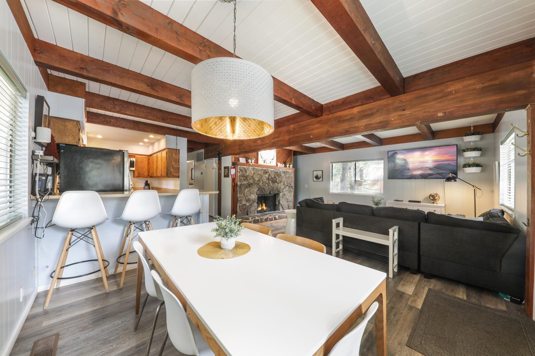 5656 Victoria Road Carnelian Bay, CA 96140 - Photo 8 of 28 a view of a dining room with furniture and wooden floor