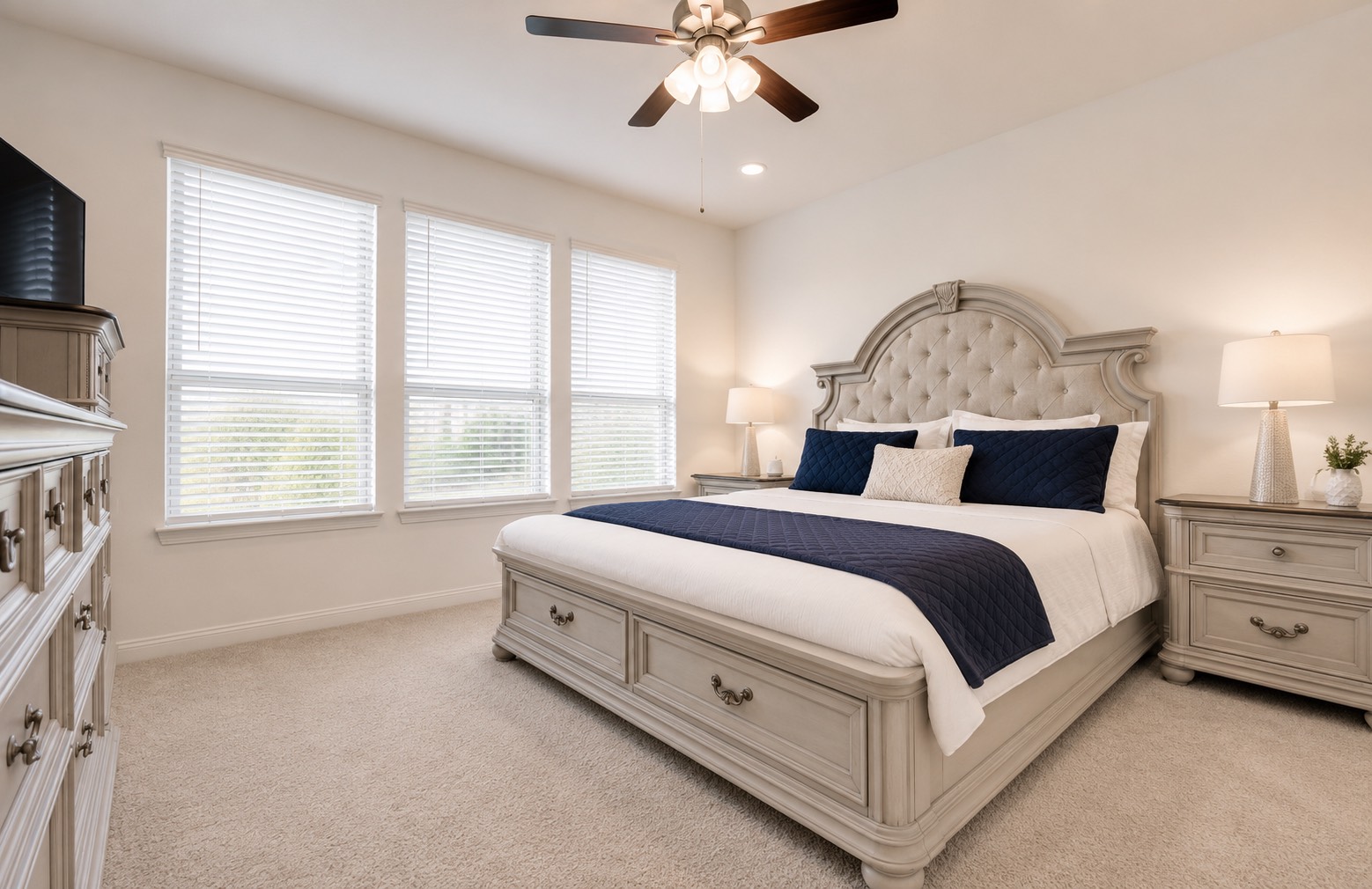 32418 Fly Fish Way Fulshear, TX 77441 - Photo 3 of 40 The primary suite is a true retreat, offering a wall of windows that flood the room with natural light, plush carpet underfoot, recessed lighting, and a ceiling fan to keep the space comfortable year round.