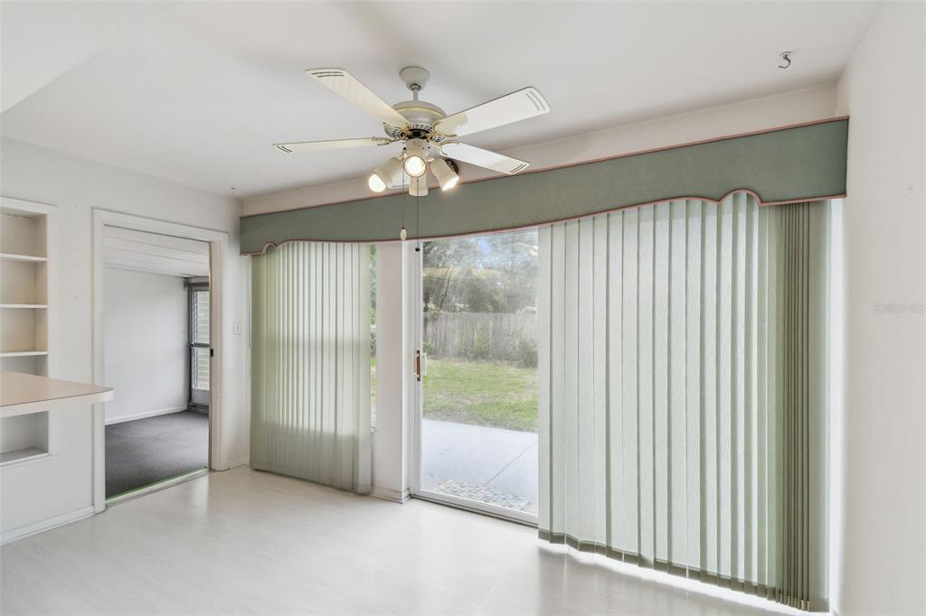 8319 Annwood Road Seminole, FL 33777 - Photo 14 of 27 an empty room with fan and windows