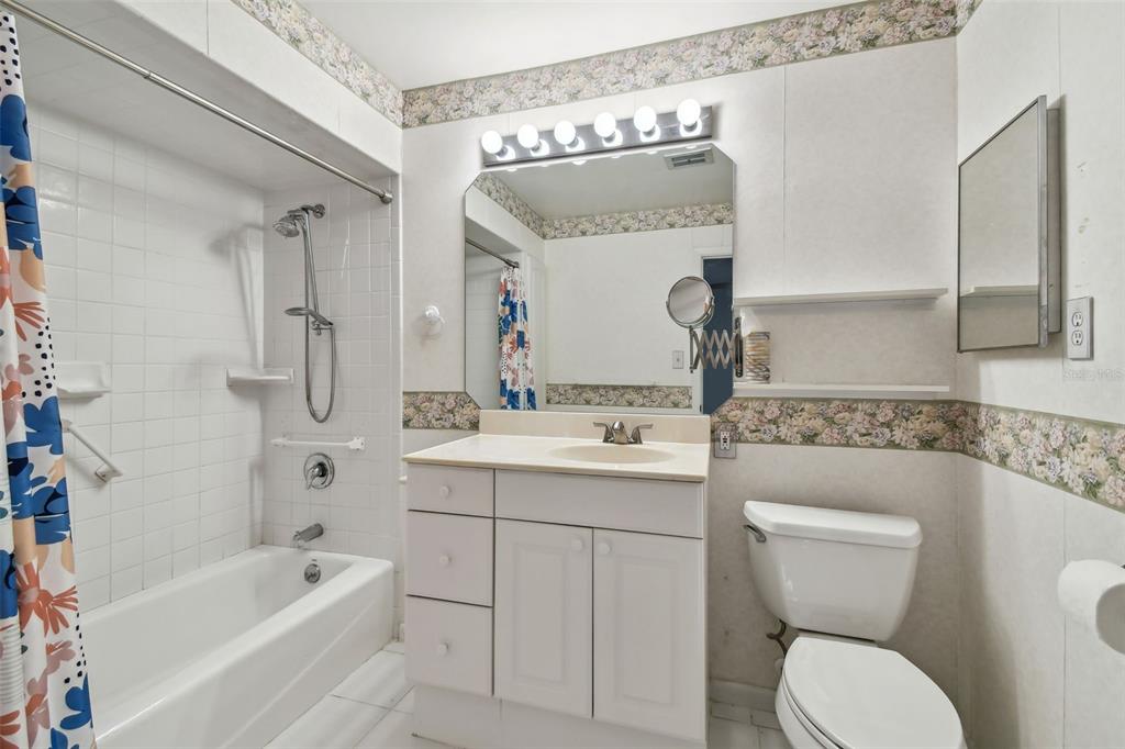 8319 Annwood Road Seminole, FL 33777 - Photo 16 of 27 a bathroom with a toilet sink and bathtub