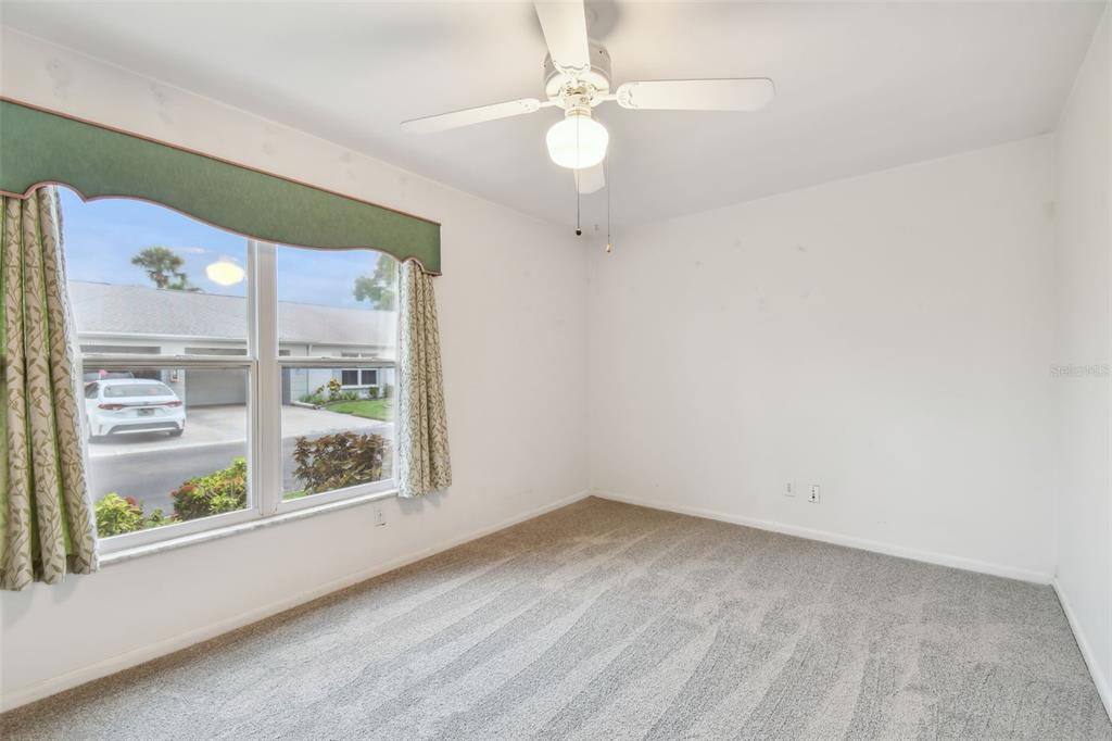 8319 Annwood Road Seminole, FL 33777 - Photo 17 of 27 an empty room with windows