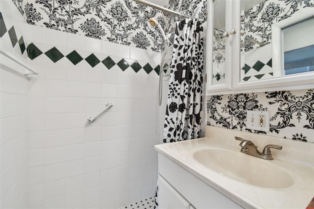 8319 Annwood Road Seminole, FL 33777 - Photo 18 of 27 a bathroom with a sink and a mirror