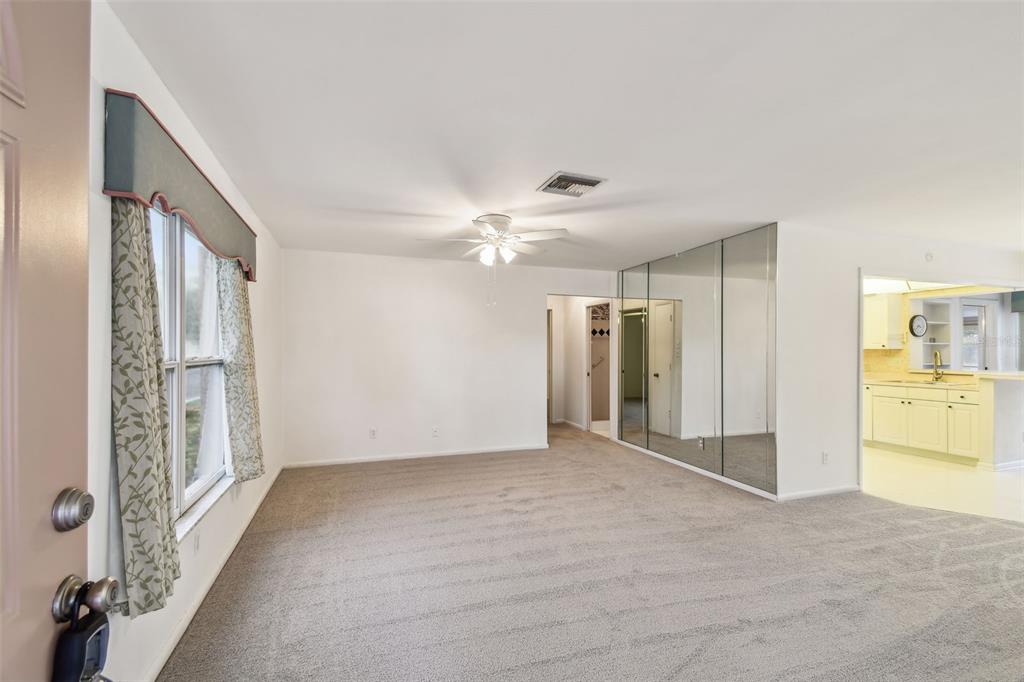 8319 Annwood Road Seminole, FL 33777 - Photo 2 of 27 a view of an empty room with a window