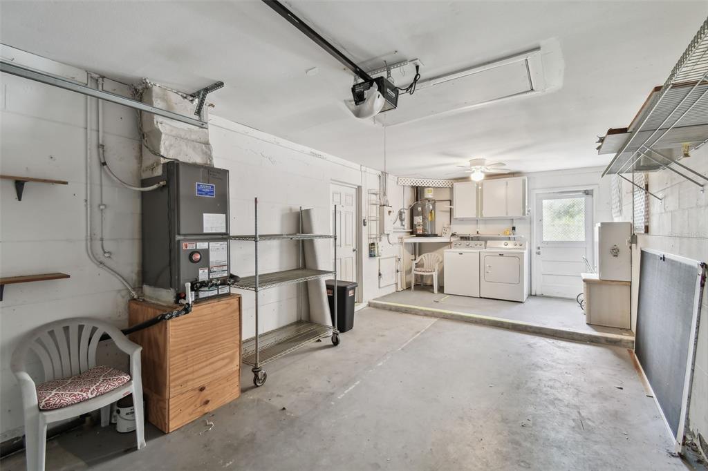 8319 Annwood Road Seminole, FL 33777 - Photo 21 of 27 a view of a kitchen with refrigerator and white cabinets