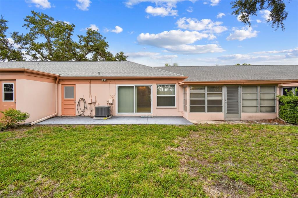 8319 Annwood Road Seminole, FL 33777 - Photo 22 of 27 front view of a house with a garden