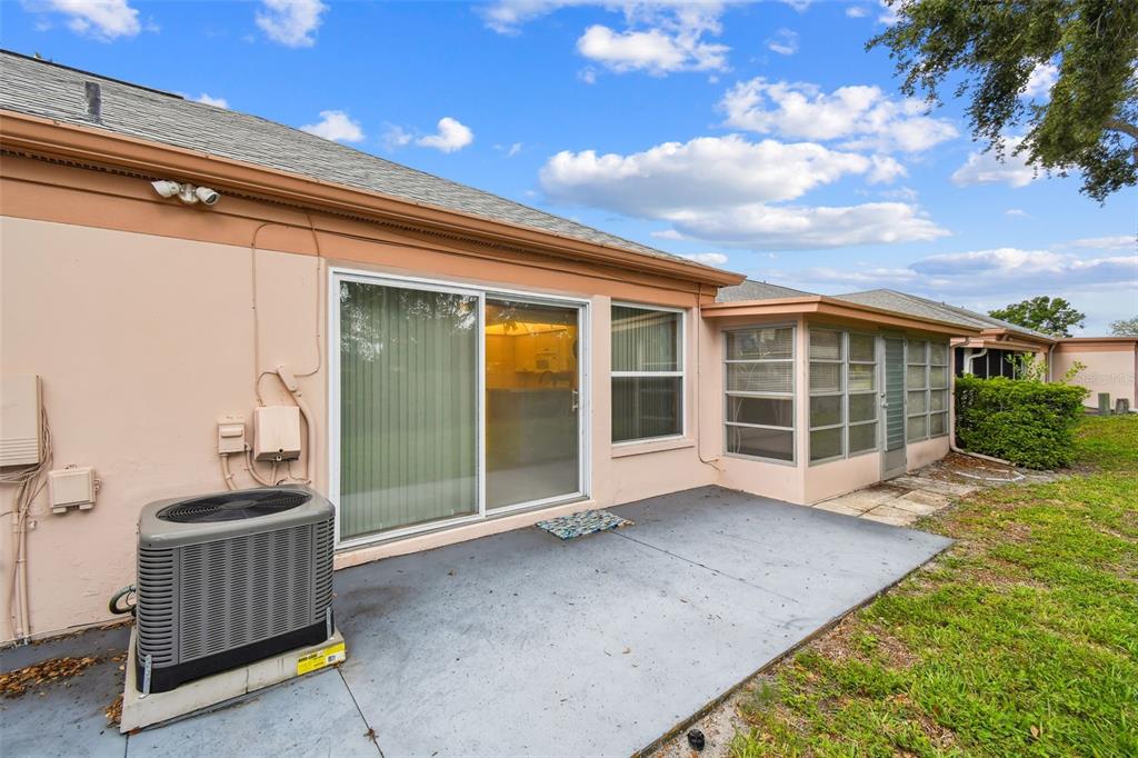 8319 Annwood Road Seminole, FL 33777 - Photo 23 of 27 a view of a porch with furniture and floor to ceiling window
