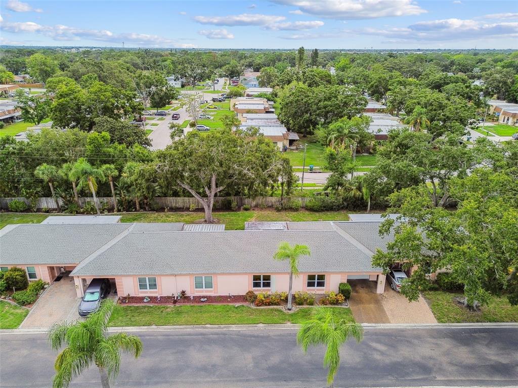8319 Annwood Road Seminole, FL 33777 - Photo 24 of 27 an aerial view of a house with a yard and lake view