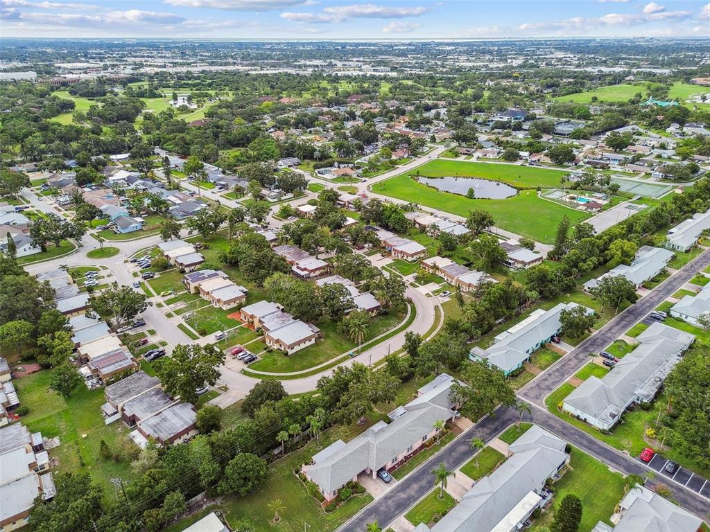 8319 Annwood Road Seminole, FL 33777 - Photo 25 of 27 an aerial view of residential houses with outdoor space