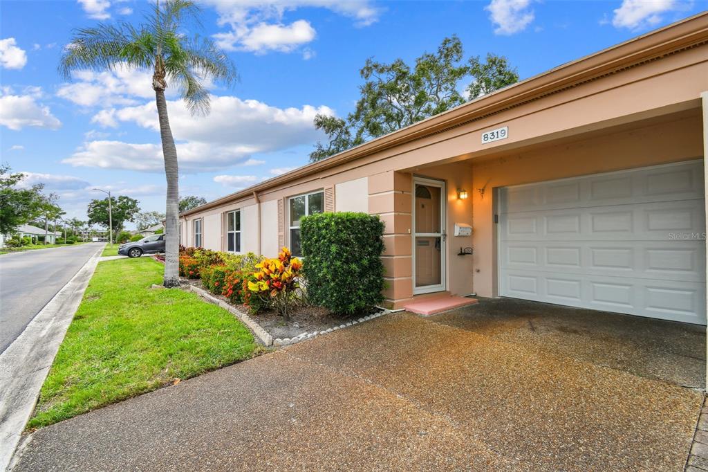 8319 Annwood Road Seminole, FL 33777 - Photo 27 of 27 a view of a house with a yard and potted plants