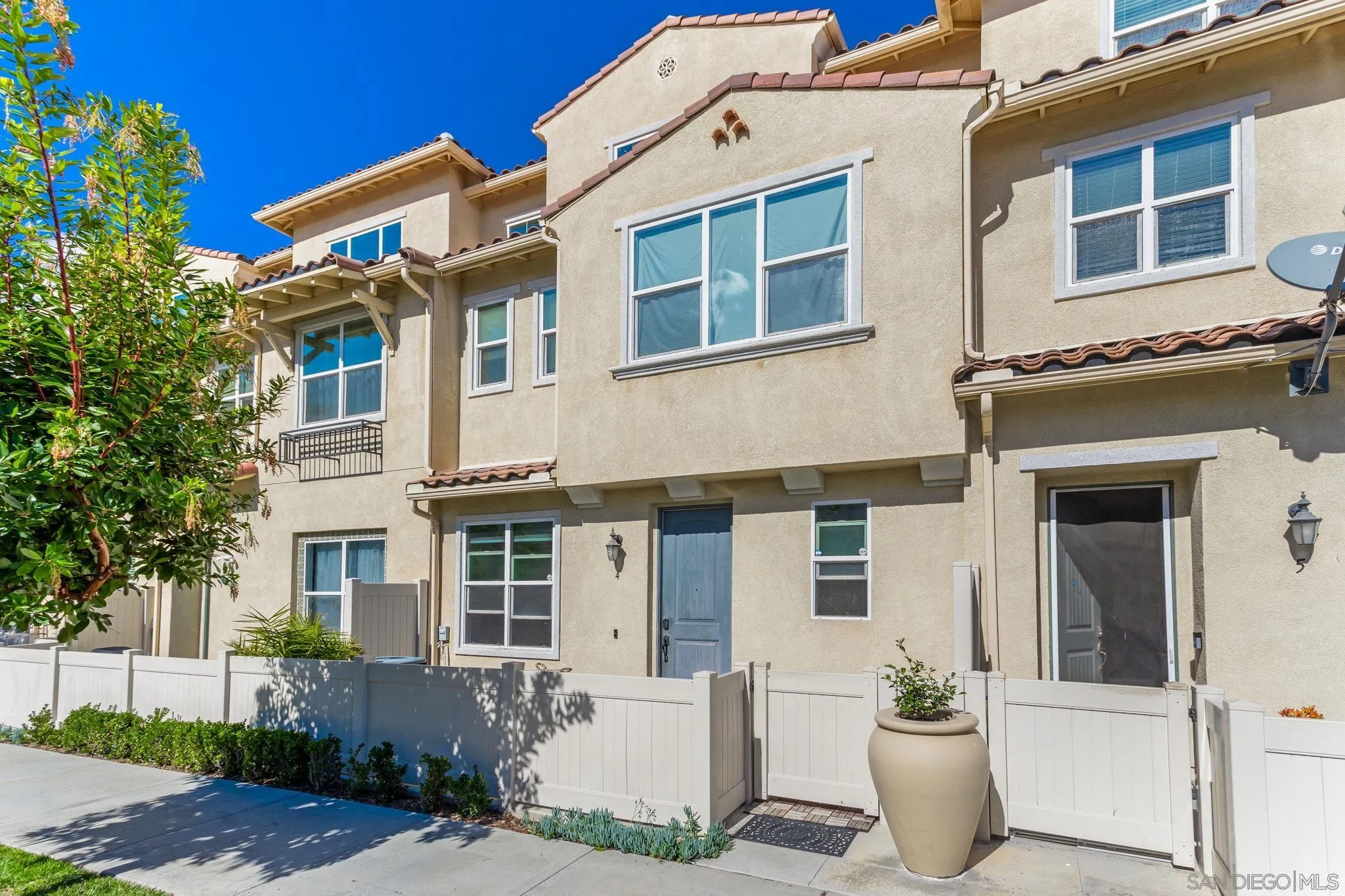 1520 Santa Carolina Road, Unit 4 Chula Vista, CA 91913 - Photo 1 of 15 a front view of a house with a yard