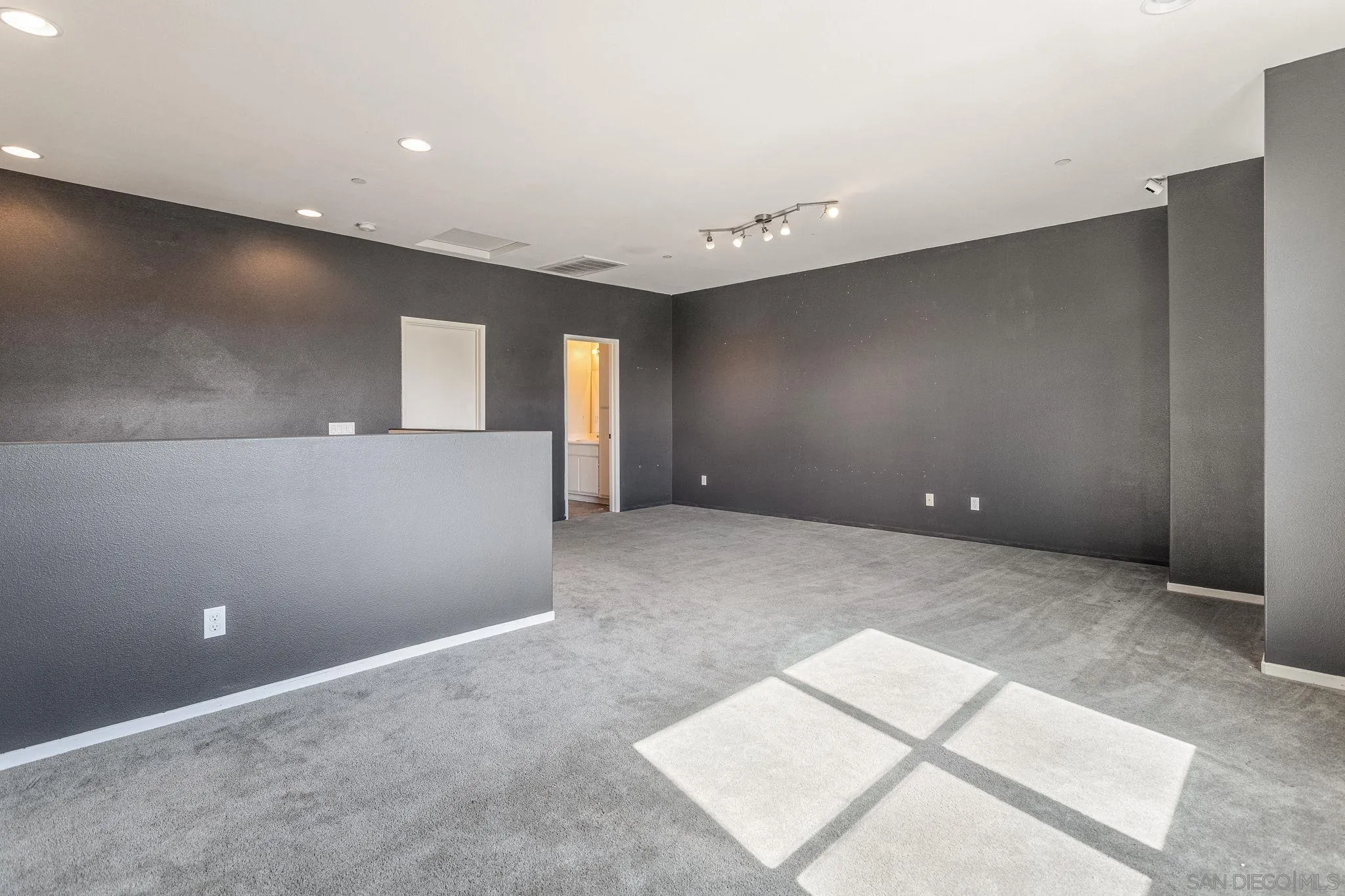 1520 Santa Carolina Road, Unit 4 Chula Vista, CA 91913 - Photo 12 of 15 a view of an empty room with windows