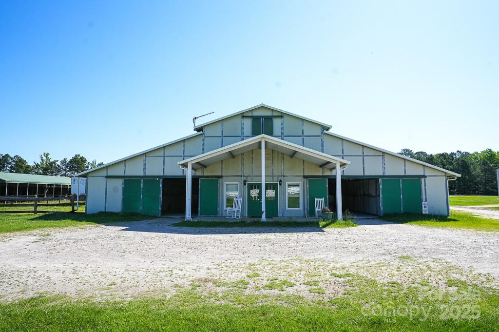 9167 Hasty Road Laurinburg, NC 28352 - Photo 15 of 48 a front view of a house with garden