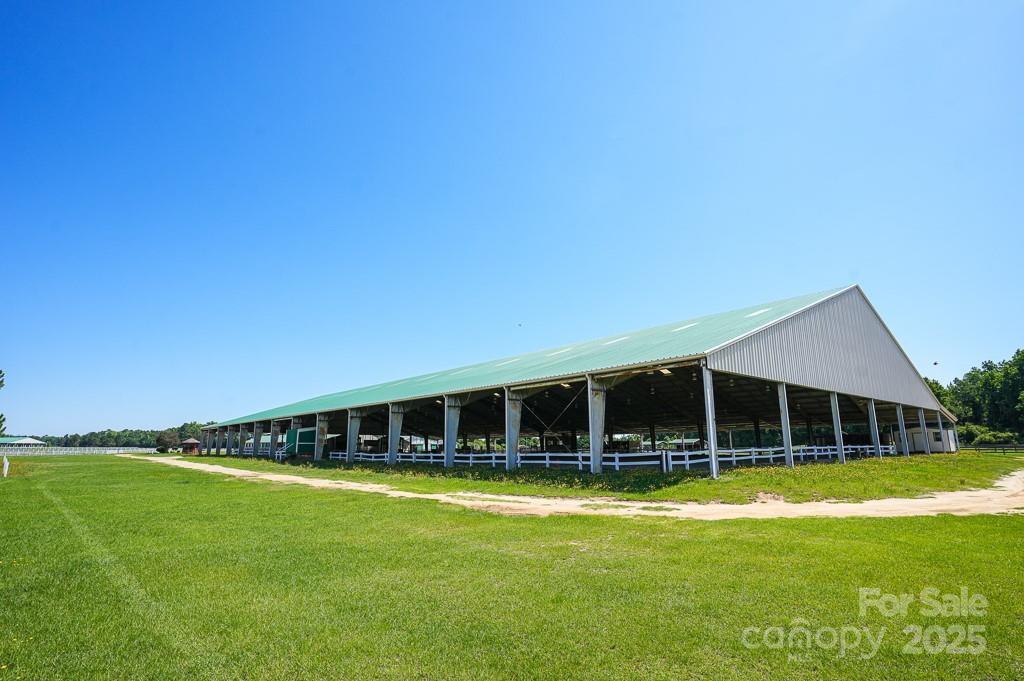 9167 Hasty Road Laurinburg, NC 28352 - Photo 29 of 48 a view of a house with swimming pool and yard
