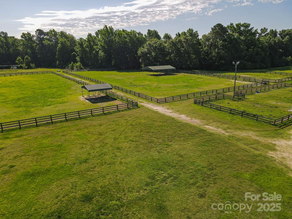 9167 Hasty Road Laurinburg, NC 28352 - Photo 47 of 48 a view of a swimming pool with an outdoor space and seating area