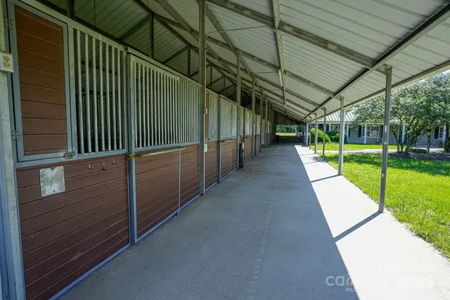 a view of yard with wooden wall