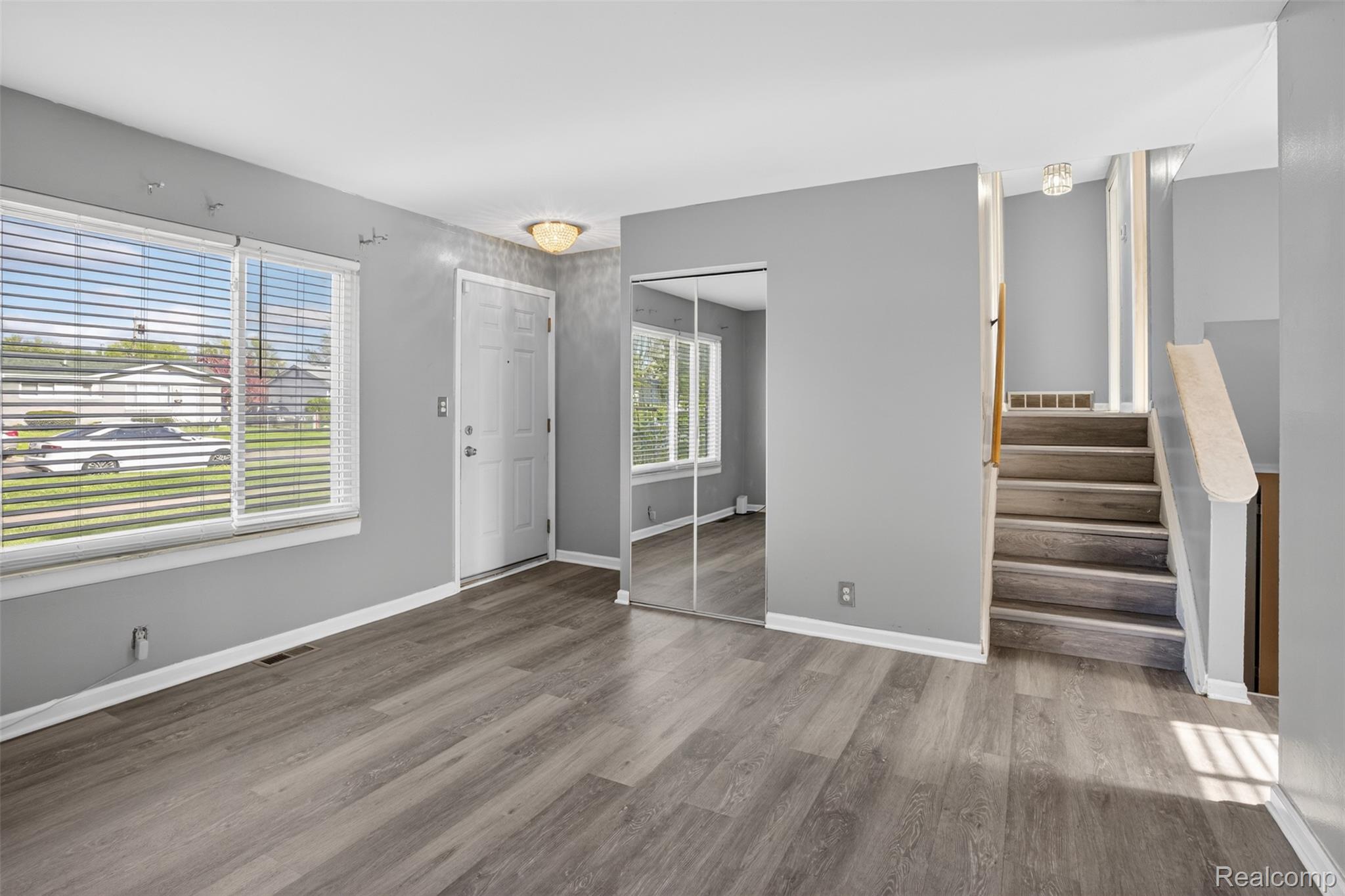 6169 Neff Road Mount Morris, MI 48458 - Photo 8 of 49 Foyer entrance with stairs and dark wood finished floors