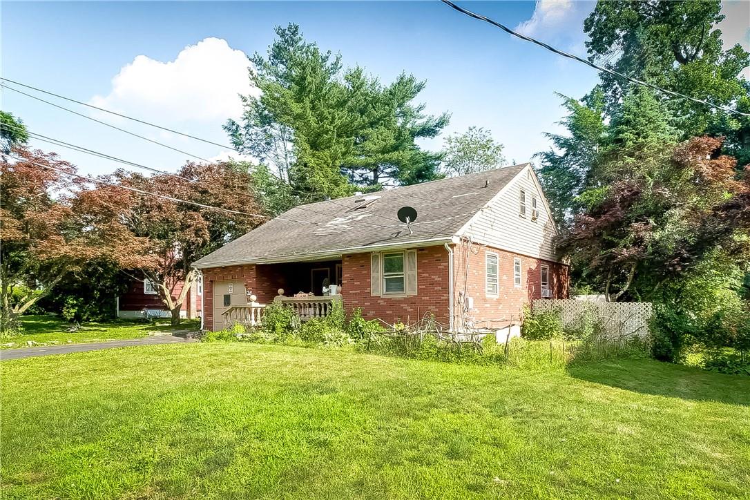 26 Locust Street Spring Valley, NY 10977 - Photo 1 of 1 a front view of house with yard and green space