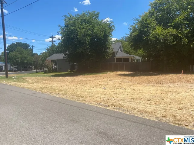 a swimming pool with an outdoor space and seating area