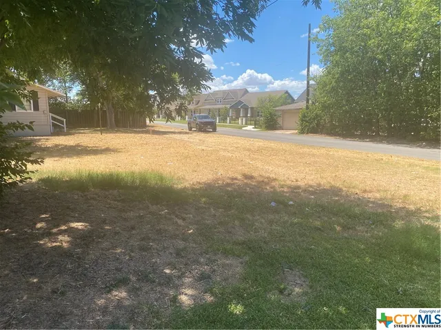 a view of the house and a yard