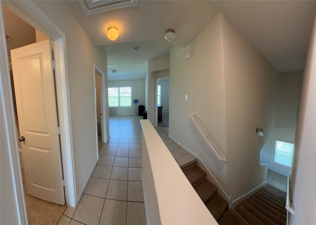 352 Circle Way, Unit 37E Jarrell, TX 76537 - Photo 12 of 39 a view of a hallway with wooden floor