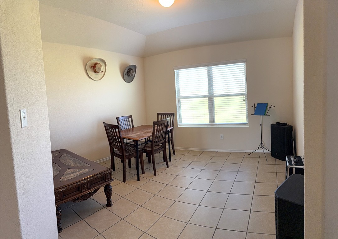 352 Circle Way, Unit 37E Jarrell, TX 76537 - Photo 14 of 39 a view of a dining room with furniture and a window
