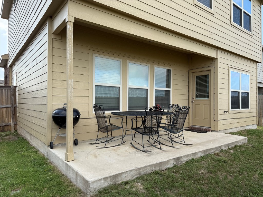 352 Circle Way, Unit 37E Jarrell, TX 76537 - Photo 4 of 39 a view of a patio with table and chairs and potted plants
