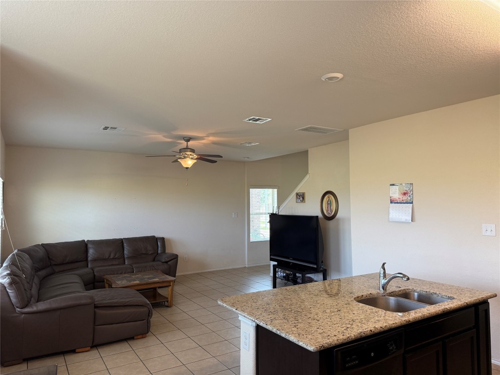 352 Circle Way, Unit 37E Jarrell, TX 76537 - Photo 7 of 39 a living room with furniture and a flat screen tv