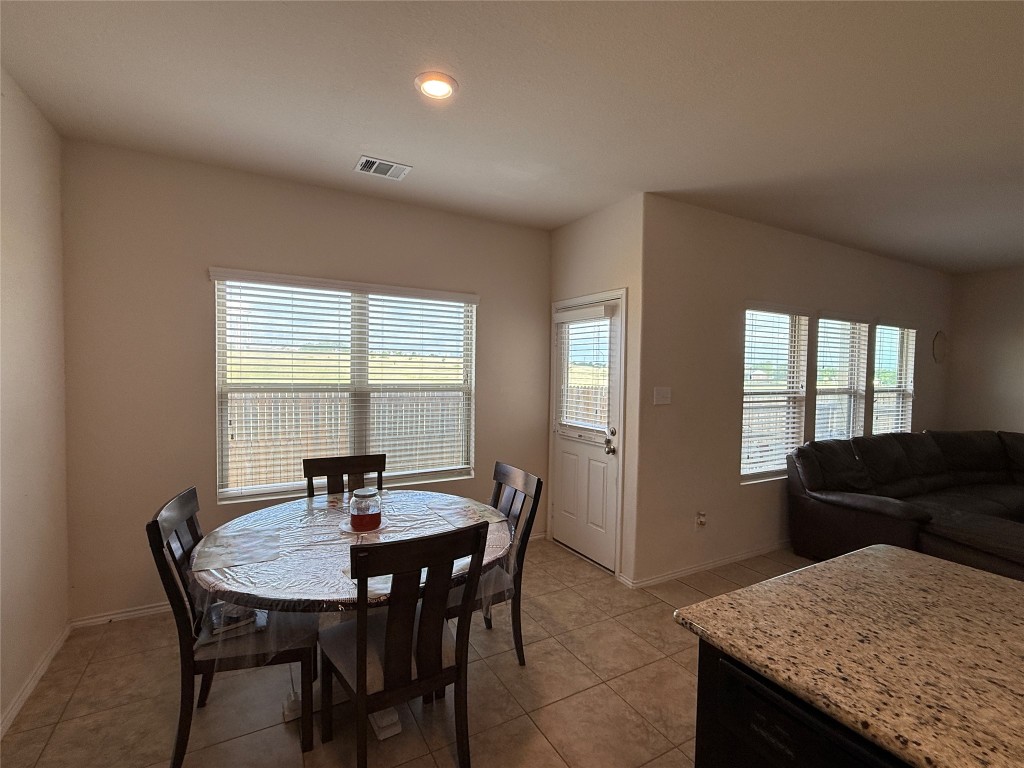 352 Circle Way, Unit 37E Jarrell, TX 76537 - Photo 8 of 39 a view of a dining room with furniture and window