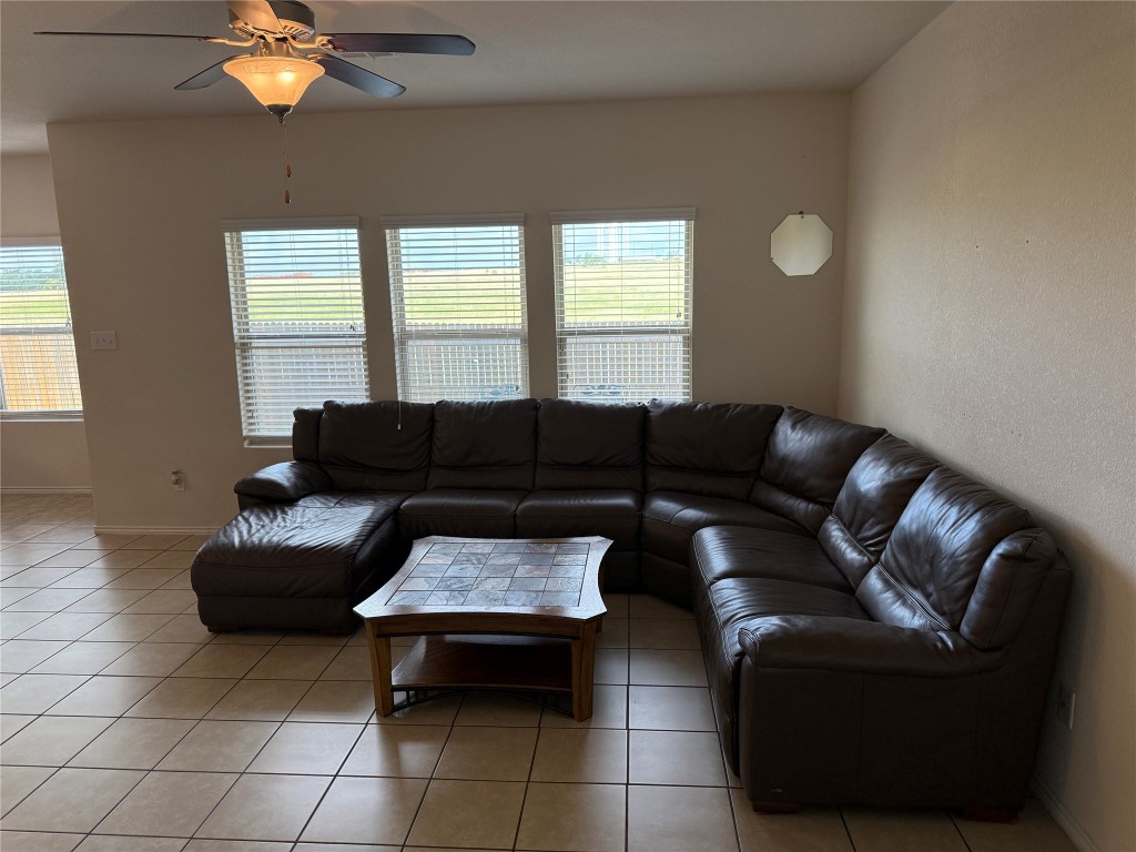 352 Circle Way, Unit 37E Jarrell, TX 76537 - Photo 10 of 39 a living room with furniture and a large window