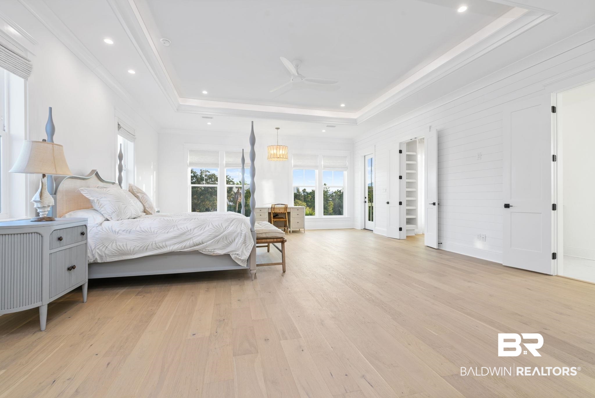 30313 River Road Orange Beach, AL 36561 - Photo 39 of 50 Bedroom with light wood finished floors, ornamental molding, a ceiling fan, and a chandelier