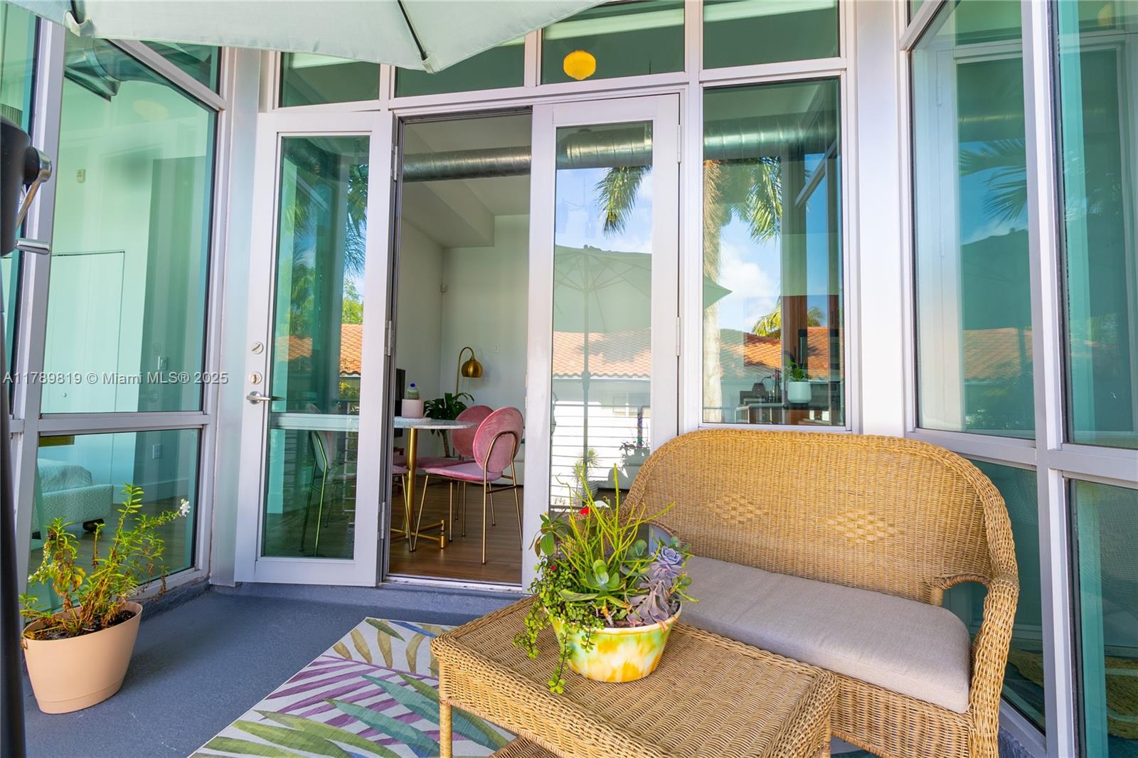 3062 Bird Avenue, Unit C1 Miami, FL 33133 - Photo 11 of 13 a living room filled with furniture and a potted plant