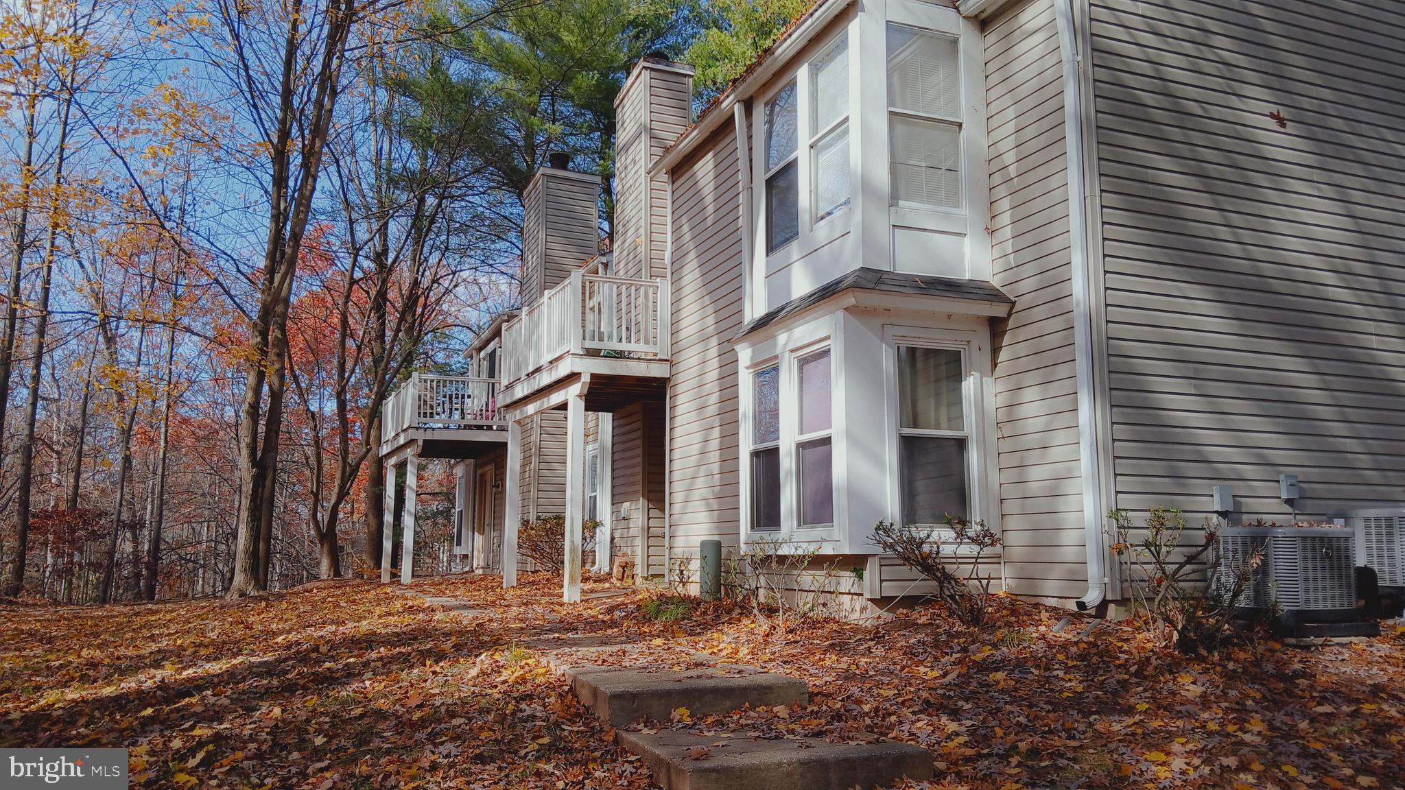 5964 Watch Chain Way, Unit 12102 Columbia, MD 21044 - Photo 1 of 20 a front view of a house with a yard