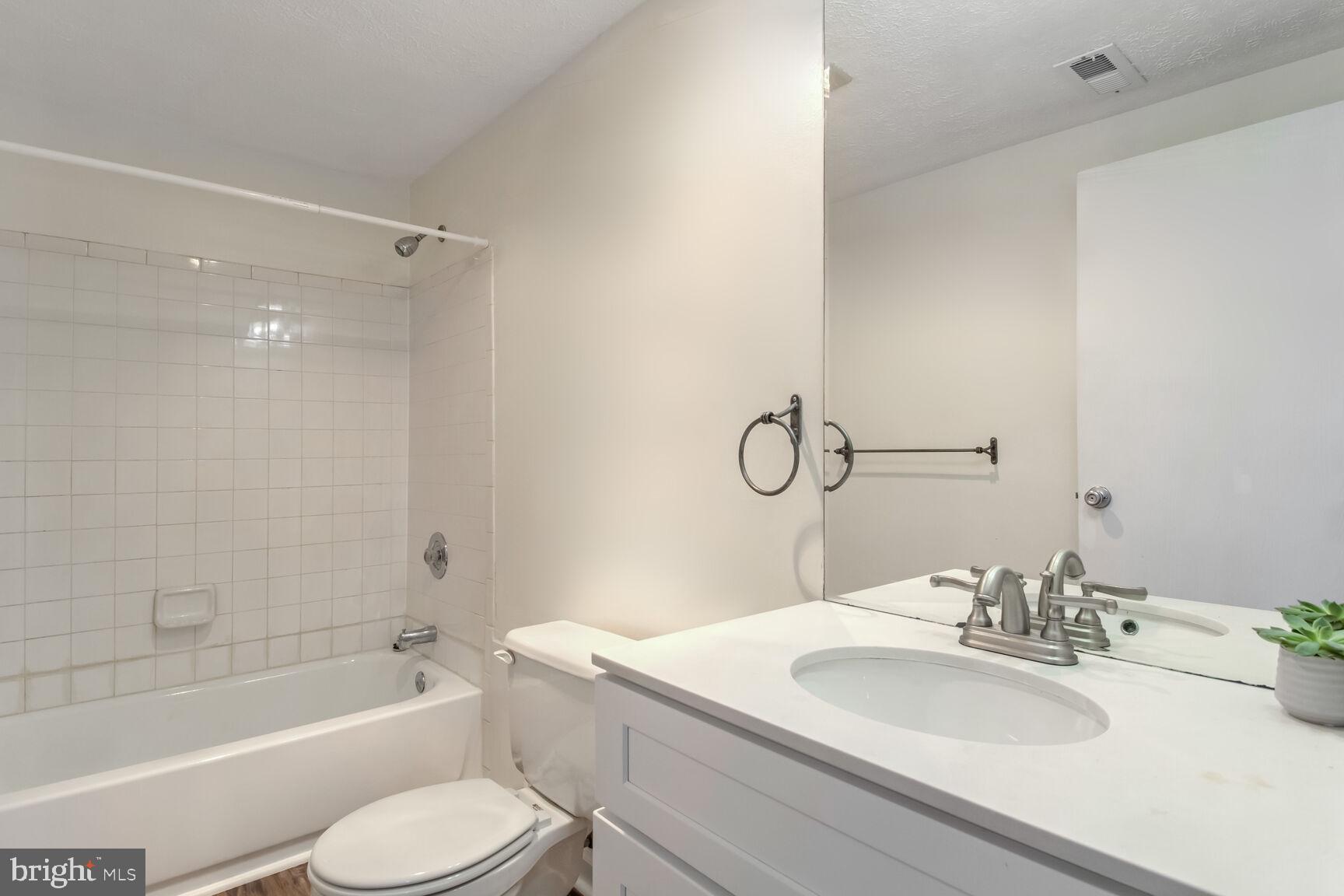 5964 Watch Chain Way, Unit 12102 Columbia, MD 21044 - Photo 15 of 20 a bathroom with a sink toilet tub and shower
