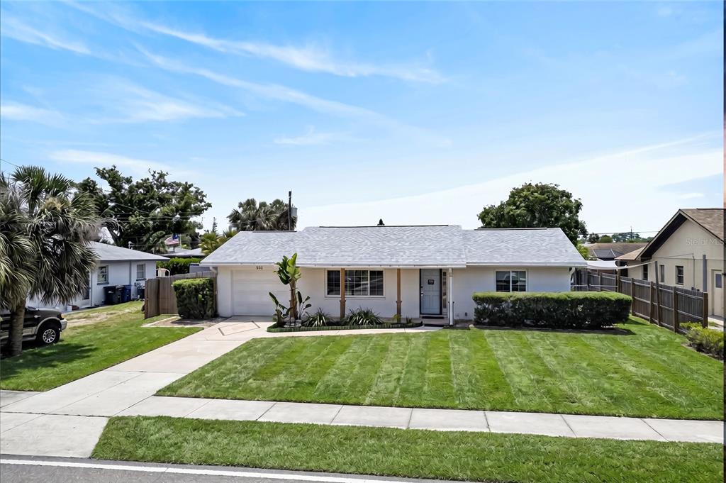 532 Center Road Venice, FL 34285 - Photo 2 of 68 a front view of a house with a garden