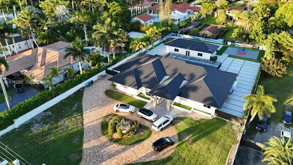 an aerial view of a house with a garden and plants