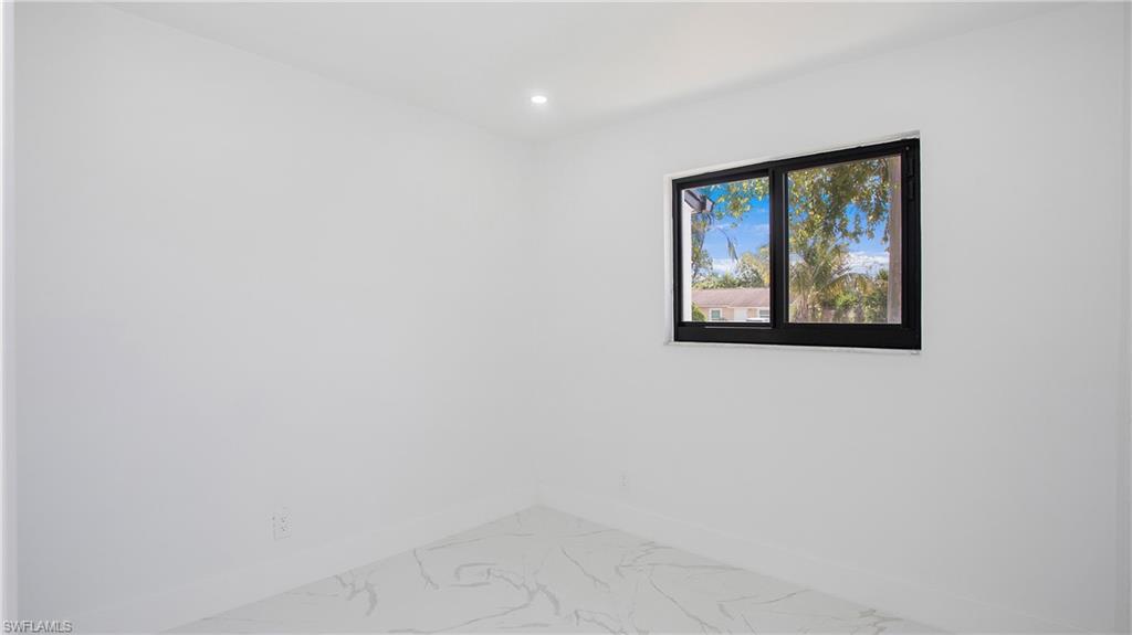 5477 Martin Street Naples, FL 34113 - Photo 12 of 21 a view of an empty room