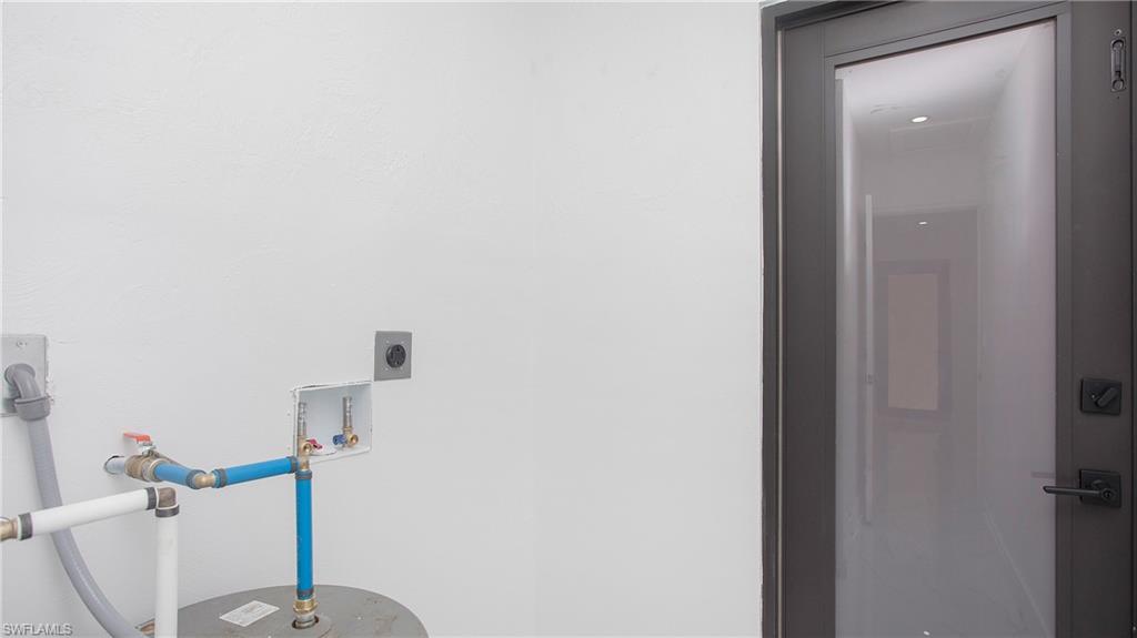 5477 Martin Street Naples, FL 34113 - Photo 18 of 21 a bathroom with a sink and toilet