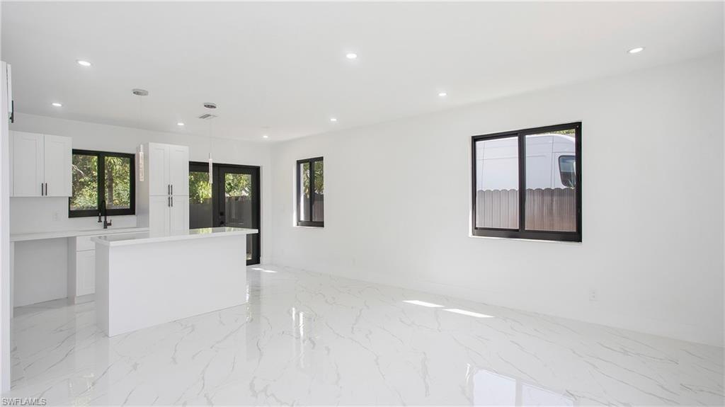 5477 Martin Street Naples, FL 34113 - Photo 10 of 21 a view of an empty room with a window