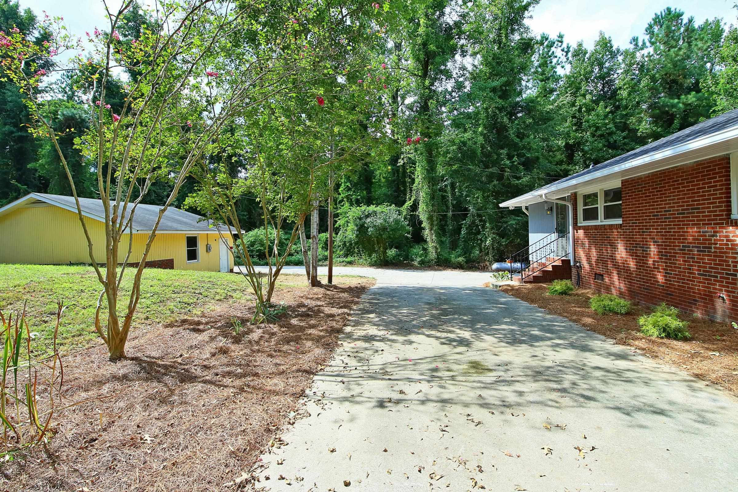 5902 Barbee Chapel Road Chapel Hill, NC 27517 - Photo 22 of 29 Back Driveway looking towards Garage