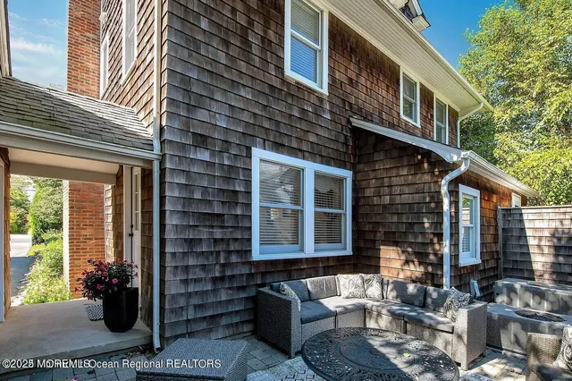 a couple of table and chairs in front of building