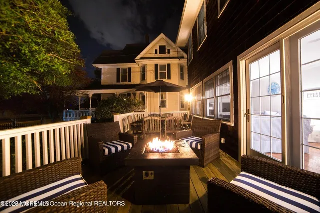 a front view of a house with outdoor seating