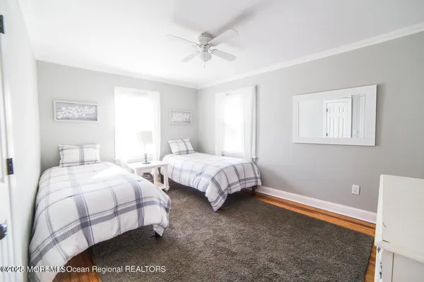 a bedroom with bed and a window