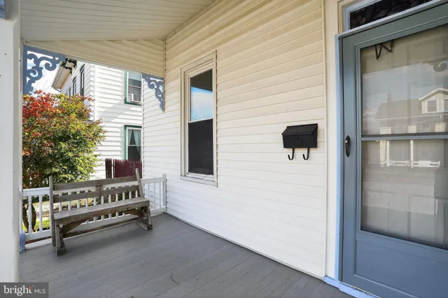 a view of front door and potted plants